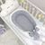 Doppelseitiges Babynest grau/weiß mit Matratze, Foto 2