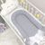 Doppelseitiges Babynest grau/weiß mit Matratze, Foto 3